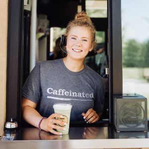 Ziggi's barista greeting a customer