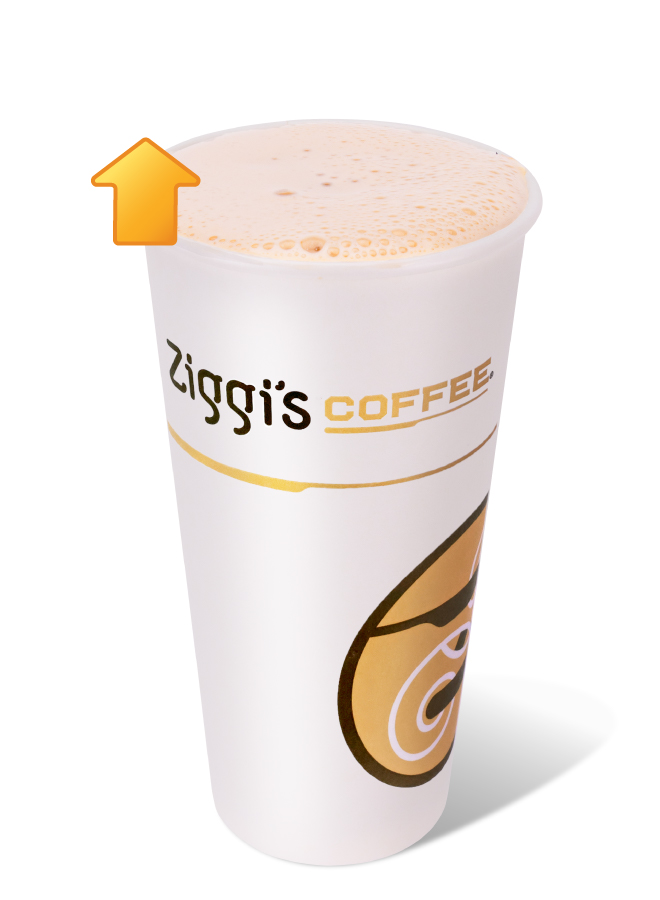 Ziggi's Coffee Hot Protein Chai in a white branded cup with a warm, frothy spiced chai top