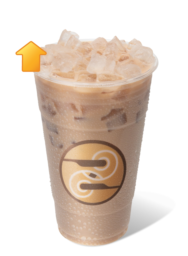Ziggi's Coffee Iced Protein Chai in a clear cup with ice and a creamy spiced chai base