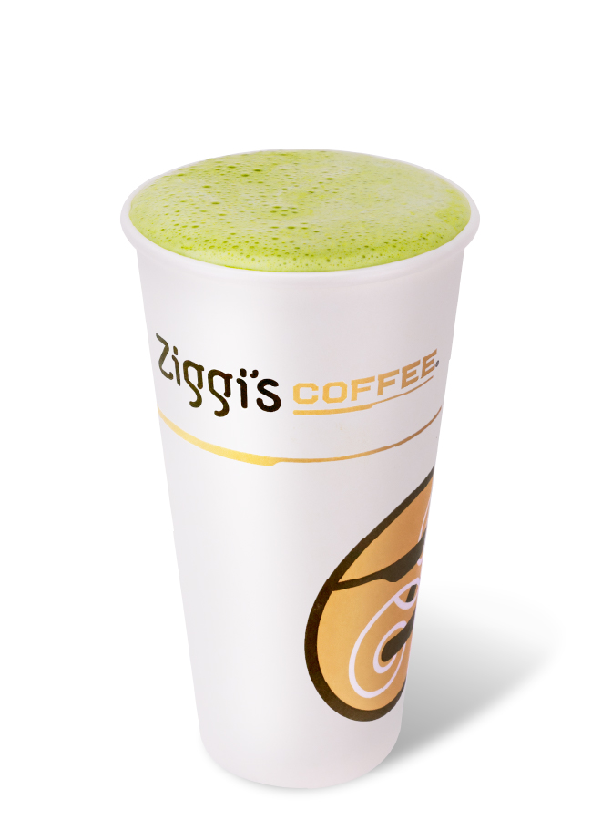 Hot cherry almond matcha latte made with oat milk in a Ziggi’s cup.