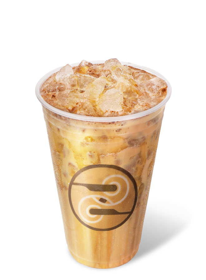 Iced honey cinnamon shaken espresso with foam and ice in a Ziggi’s cup.