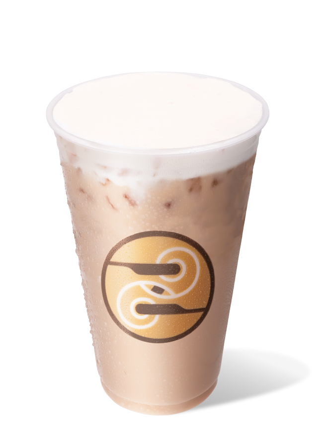 Iced Banana Bread Chai with a Ziggi's logo cup, with sweet cream cold foam.
